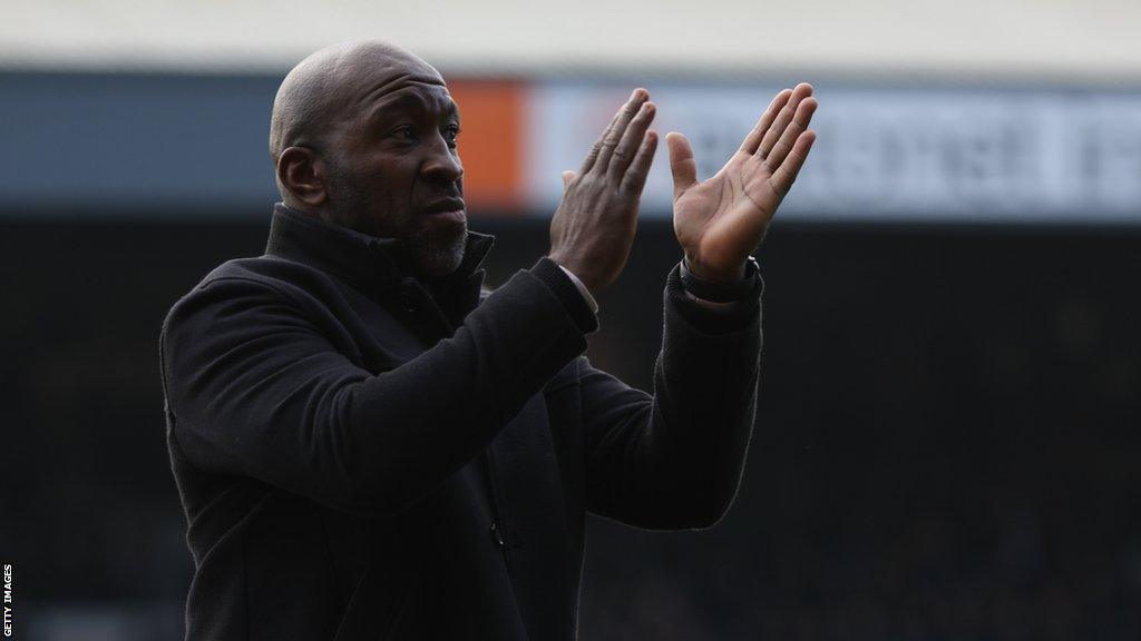 Port Vale boss Darren Moore claps the fans after a match