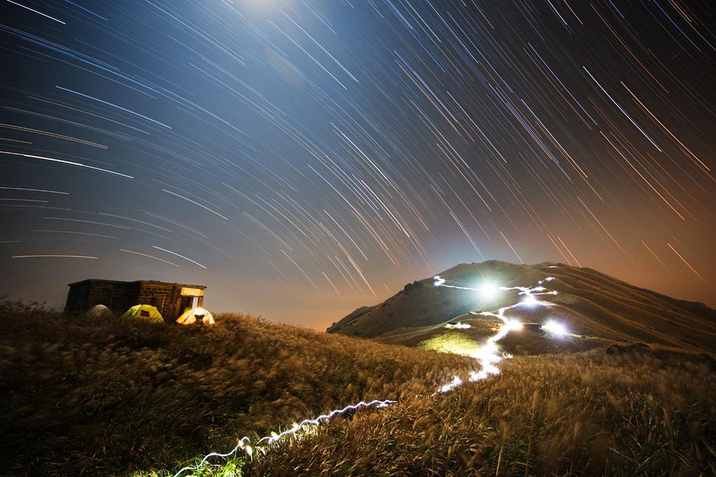 Sunset Peak Star Trail - Lantau Island, Hong Kong - by Chap Him Wong (People and Space, Winner)