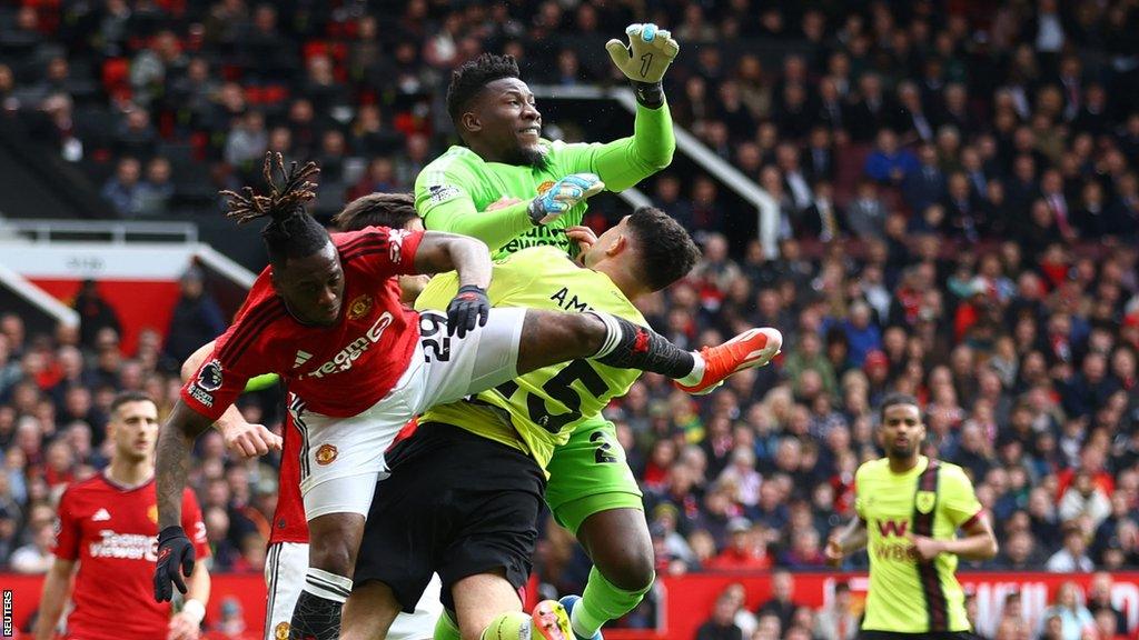 Man Utd's Andre Onana gives away a penalty after colliding with Burnley's Zeki Amdouni in the Premier League game at Old Trafford