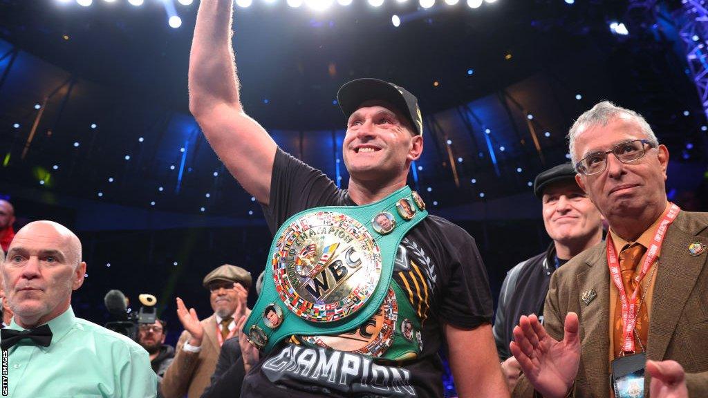 Tyson Fury celebrates with his WBC title