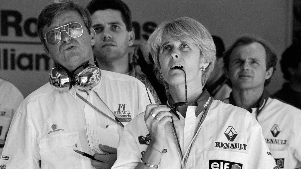 Williams team members watch on as medics attend to Ayrton Senna on track at the San Marino Grand Prix in 1994 