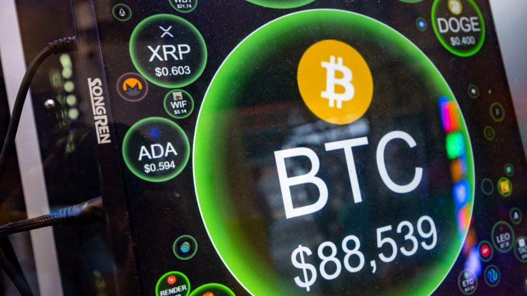 A screen shows the price of Bitcoin against US dollars at a cryptocurrency exchange store in Hong Kong, China, on Tuesday, Nov. 12, 2024