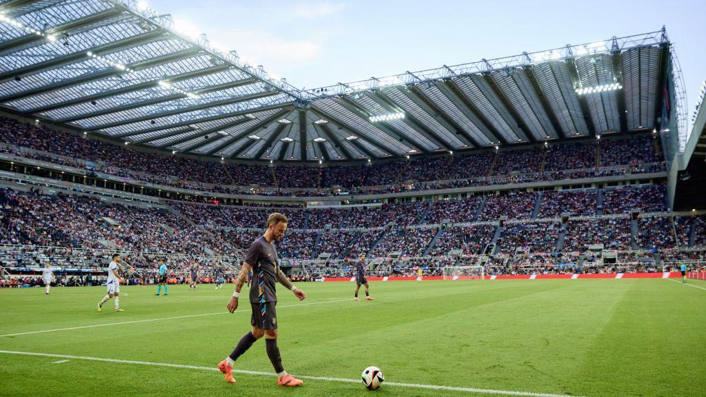 James Maddison takes a corner at St James' Park in 2024