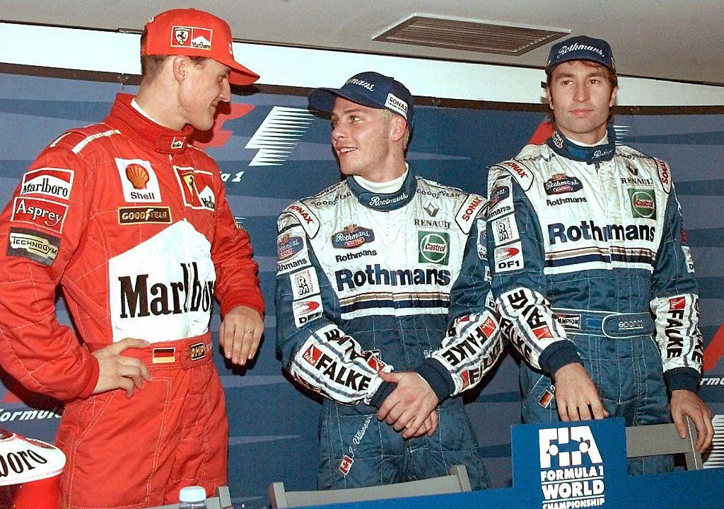 Michael Schumacher, Jacques Villeneuve and Heinz-Harald Frentzen talk at the FIA press conference after qualifying for the 1997 Formula 1 European Grand Prix in Jerez, Spain.