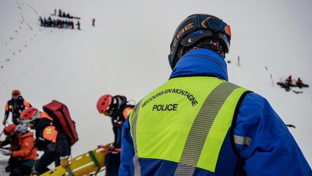 A high mountain rescue police officer takes part in a search and rescue exercise for avalanche victims in the French Alps