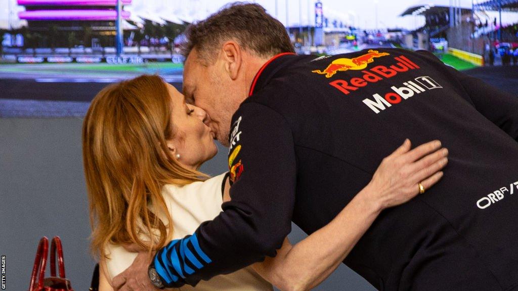 Red Bull F1 team boss Christian Horner and wife Geri kiss before the first race of the season