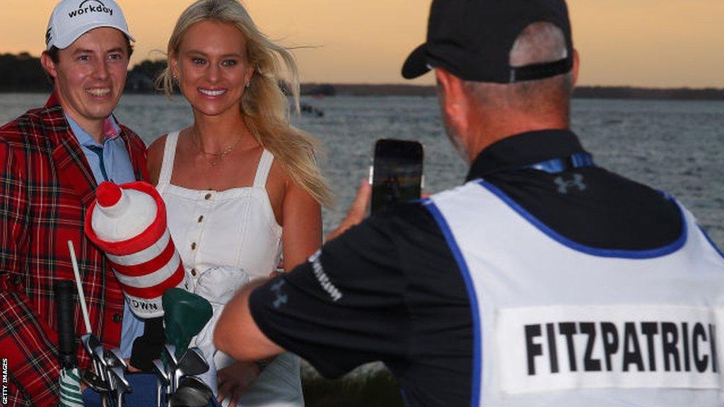 Matt Fitzpatrick and his girlfriend are photographed by caddie Billy Foster