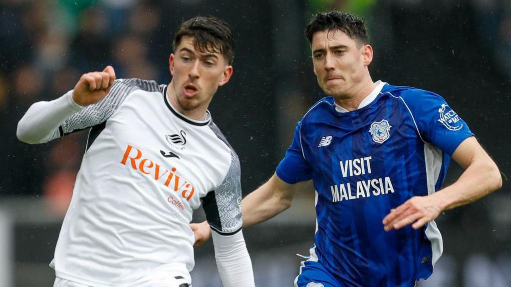 Swansea's Josh Key competes with Cardiff's Callum O'Dowda