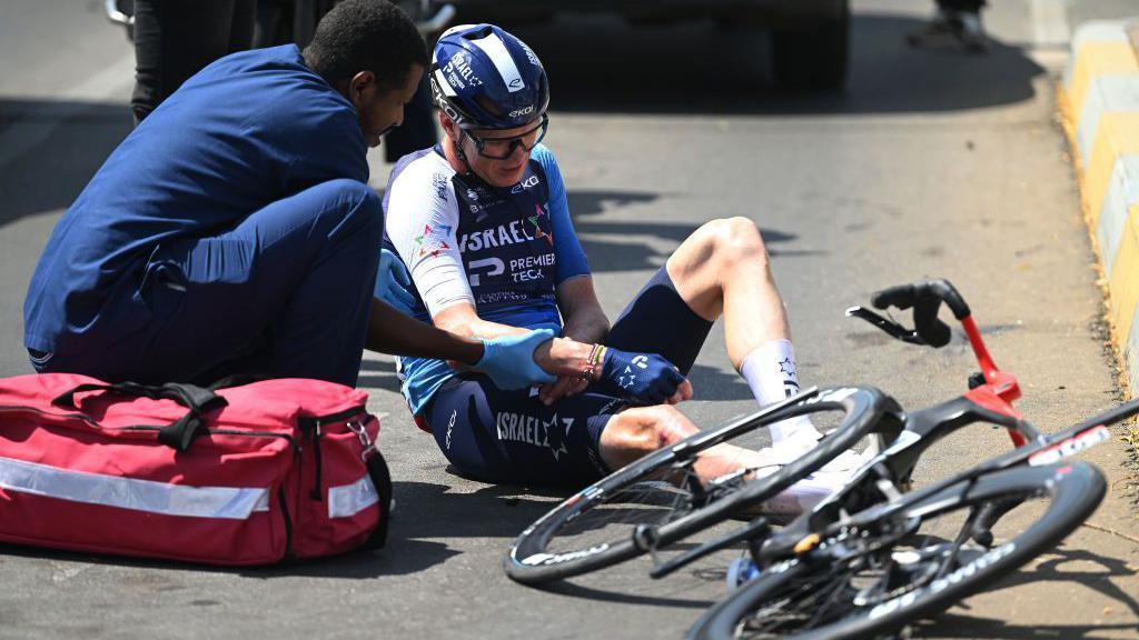 Chris Froome getting medical treatment after his crash