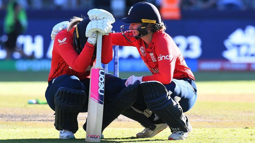 Sarah Glenn is consoled by Charlie Dean after England are knocked out of the T20 World Cup in Cape Town, 2023