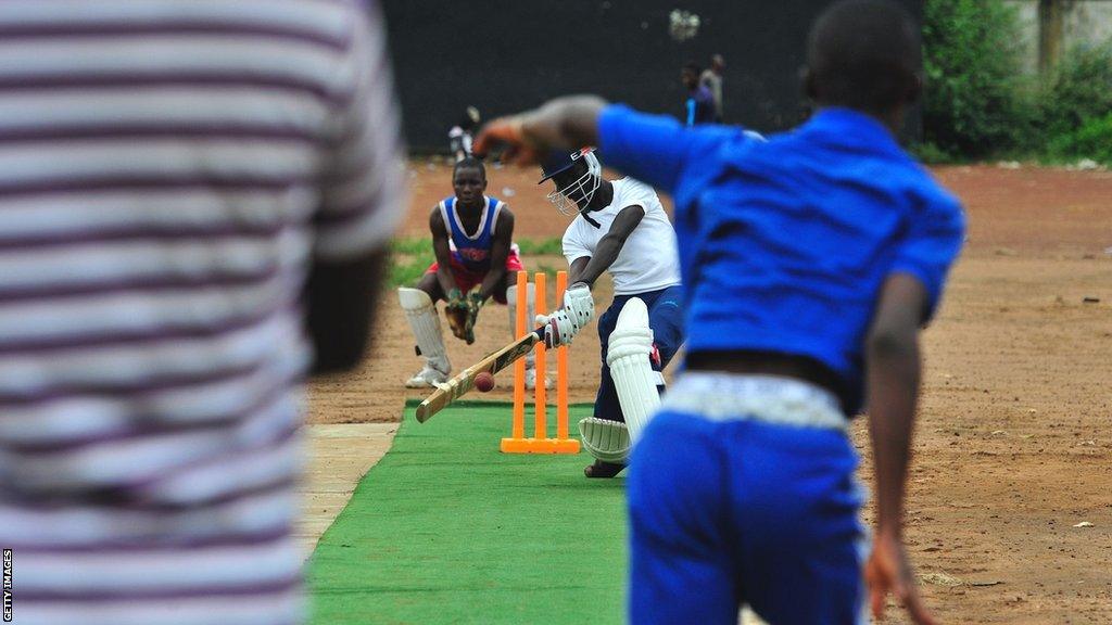 Children play cricket in Sierra Leone