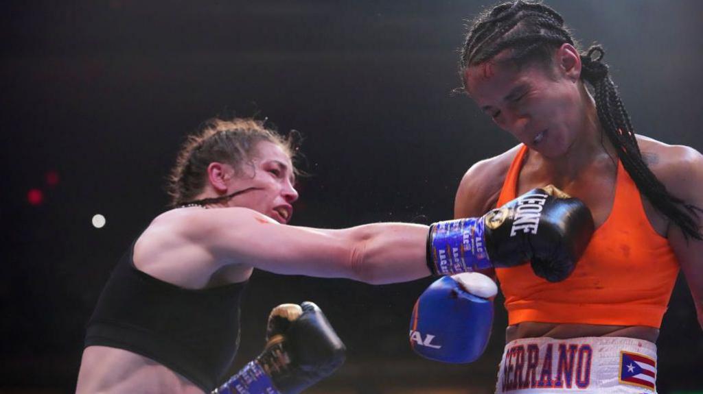 Katie Taylor punching Amanda Serrano