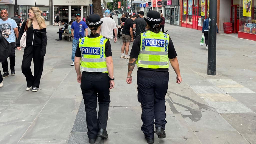 Police walking in Swindon town centre