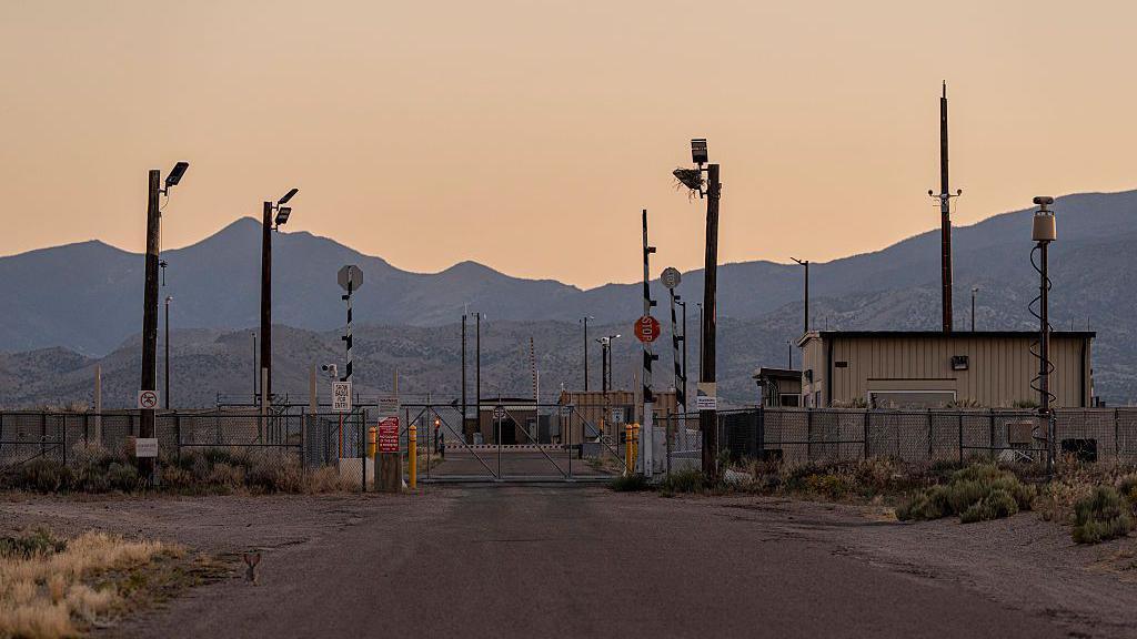 The area outside Area 51 with the sun setting in the background