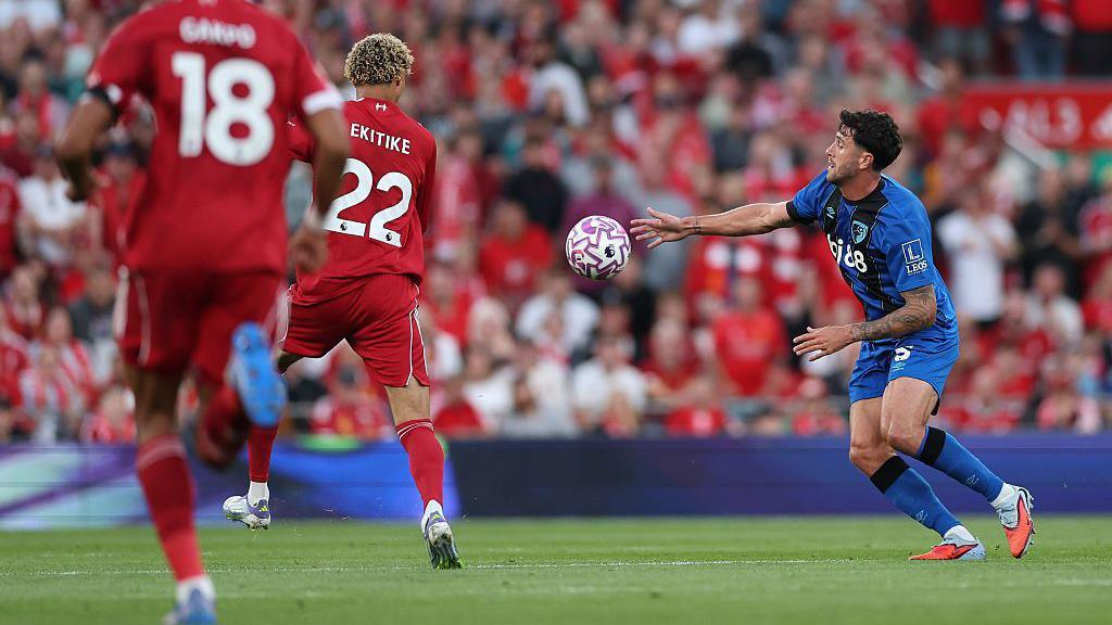 Marcos Senesi of Bournemouth handles the ball denying Liverpool's Hugo Ekitike a run on goal 