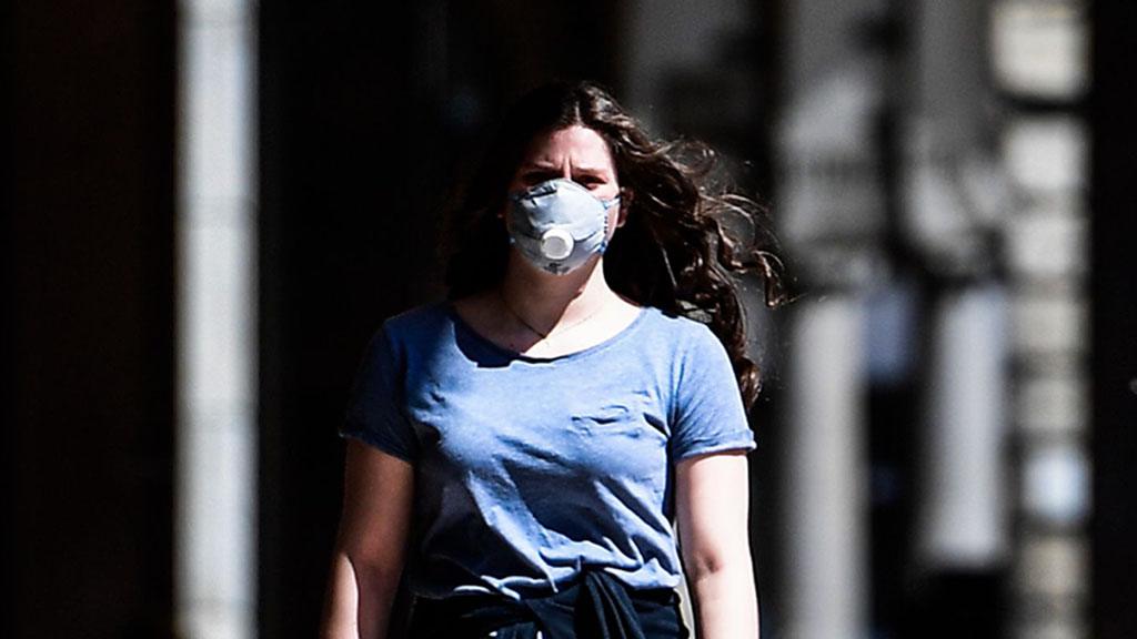 Woman wearing mask in Milan