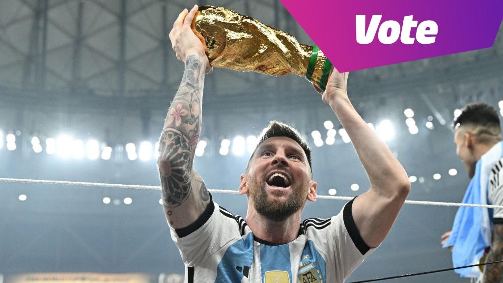 messi holding trophy