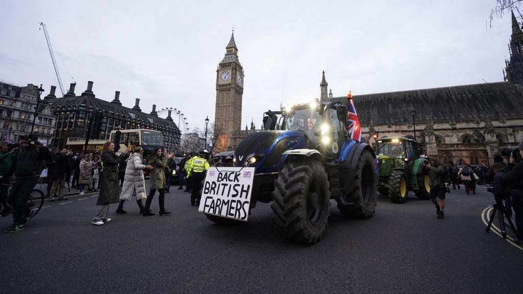 Farmers take part in a tractor "go-slow" through Parliament Square, Westminster