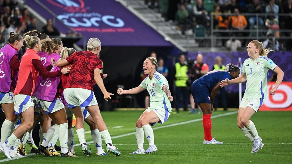Jess Fishlock celebrating after scoring Wales' goal against France.