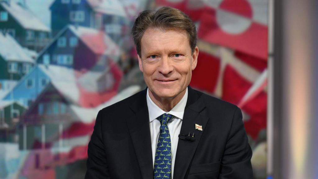 Lisa Nandy speaking seriously into a microphone during a television interview setting.