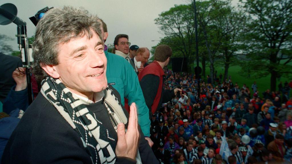 A smiling Kevin Keegan during an open-top bus parade in Newcastle in May 1993