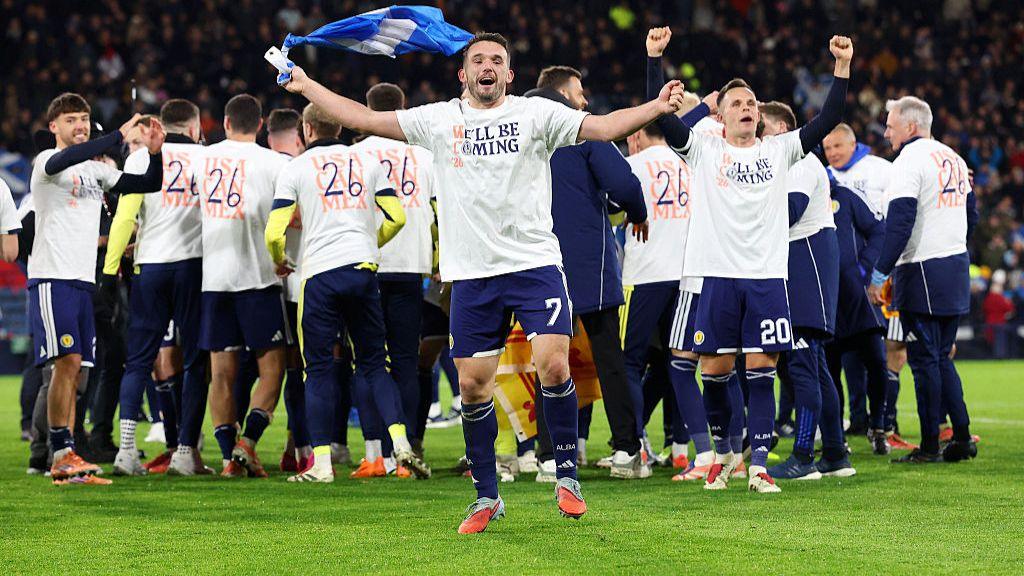 John McGinn of Scotland celebrates after the team's victory during the FIFA World Cup 2026 qualifier match between Scotland and Denmark.