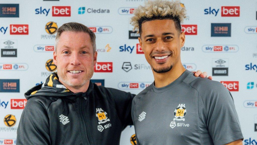 Lyle Taylor with Cambridge boss Neil Harris