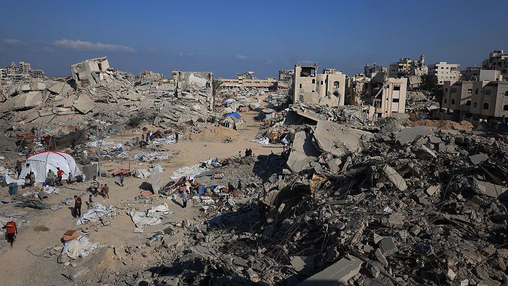 File pic of badly damaged Sheikh Radwan neighbourhood