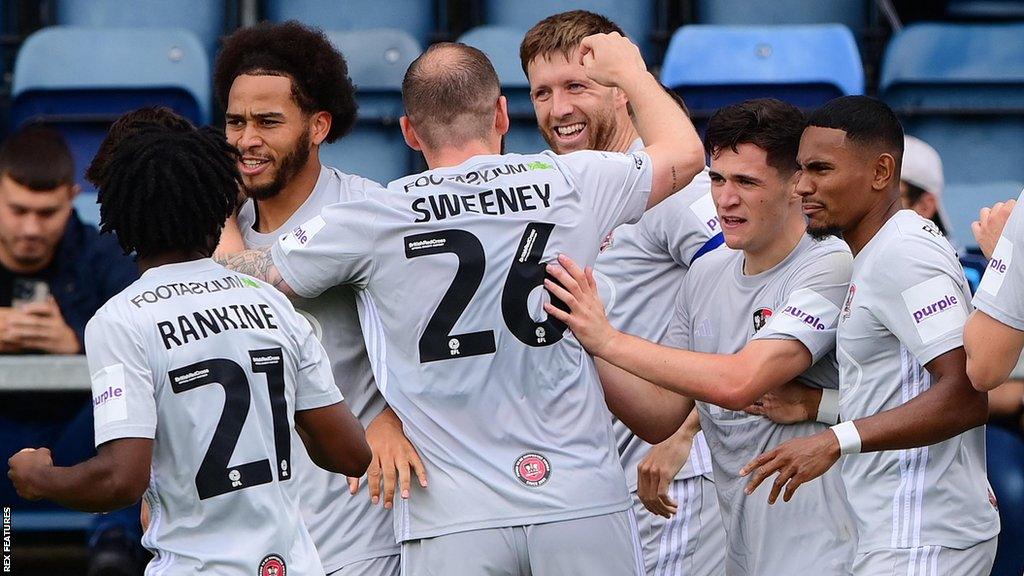 Exeter City celebrate a goal by Will Aimson