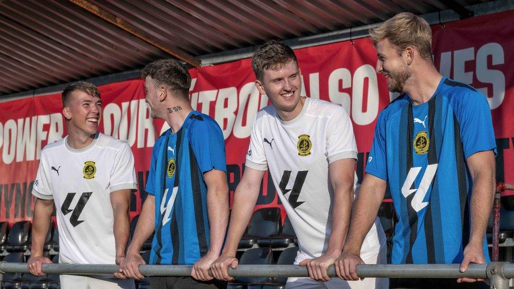 Llanfairpwll players show off the club's new shirts