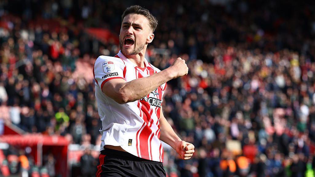 Taylor Harwood-Bellis celebrates after Southampton win a game