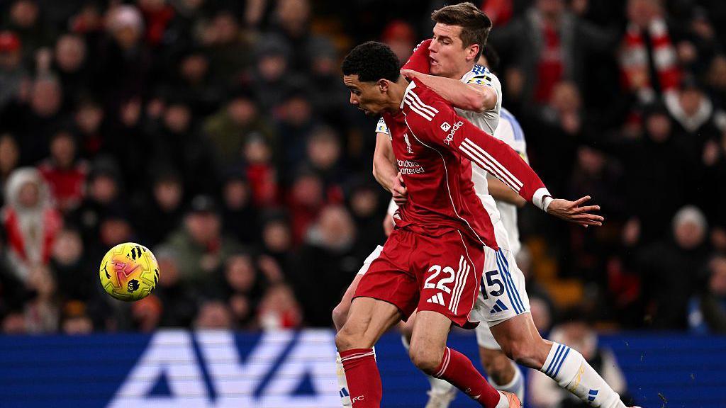 Hugo Ekitike of Liverpool is challenged by Jaka Bijol of Leeds United 