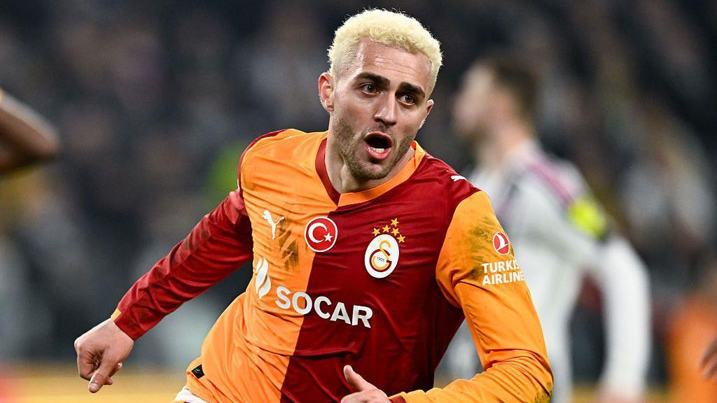 Galatasaray's Baris Yilmaz celebrates after scoring the team's second goal against Juventus