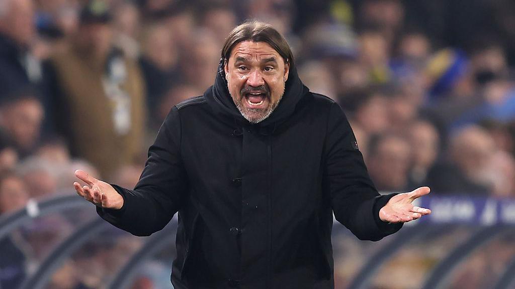 Leeds United boss Daniel Farke raises his arms