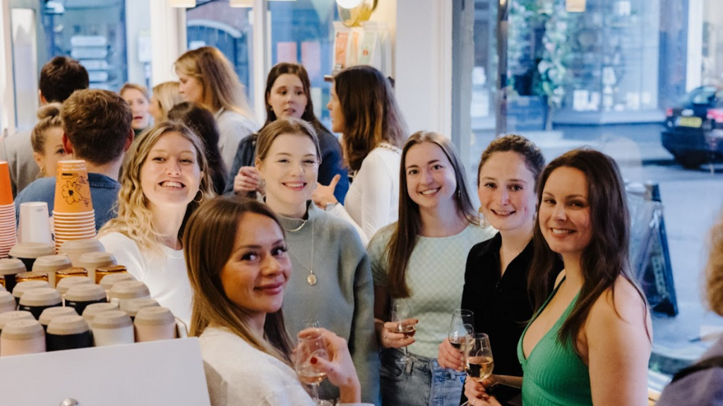 Six women look to the camera for the picture 