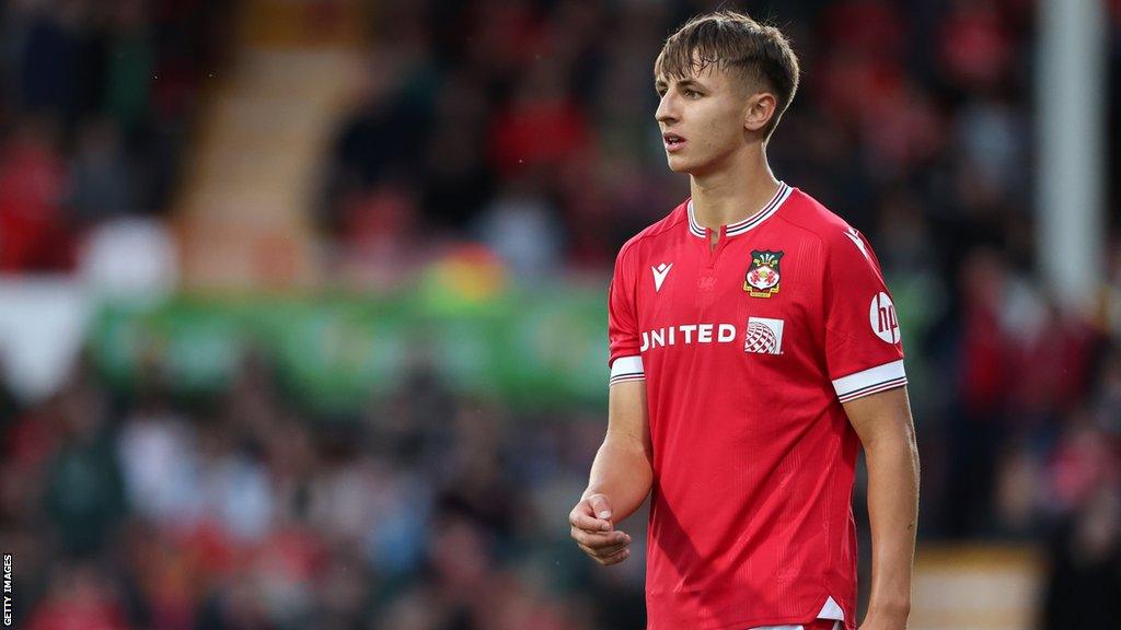 Wrexham's Max Cleworth looks on during a match