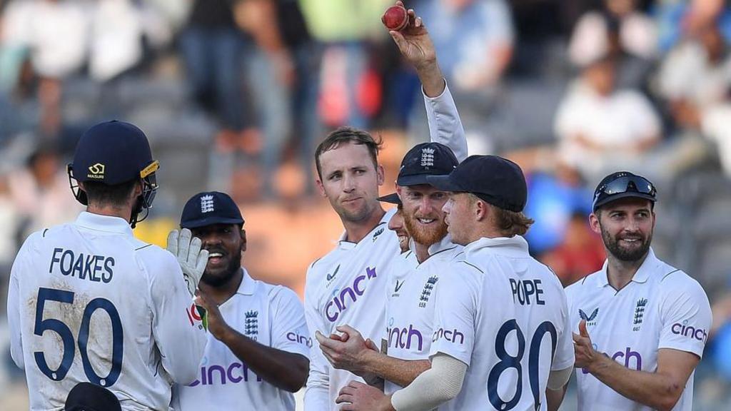 Tom Hartley celebrates a five-wicket haul in Hyderabad