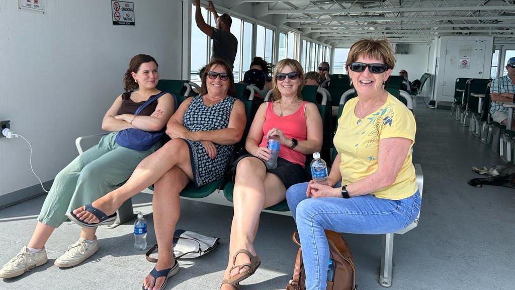 Women smiling while on the ferry to Beaver Island