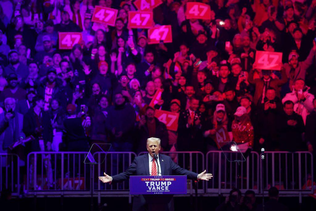 Donald Trump addresses the crowd on stage at his pre-inauguration rally