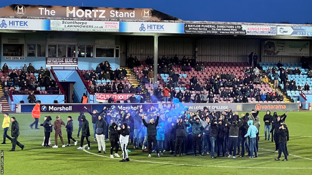 Scunthorpe fans on pitch