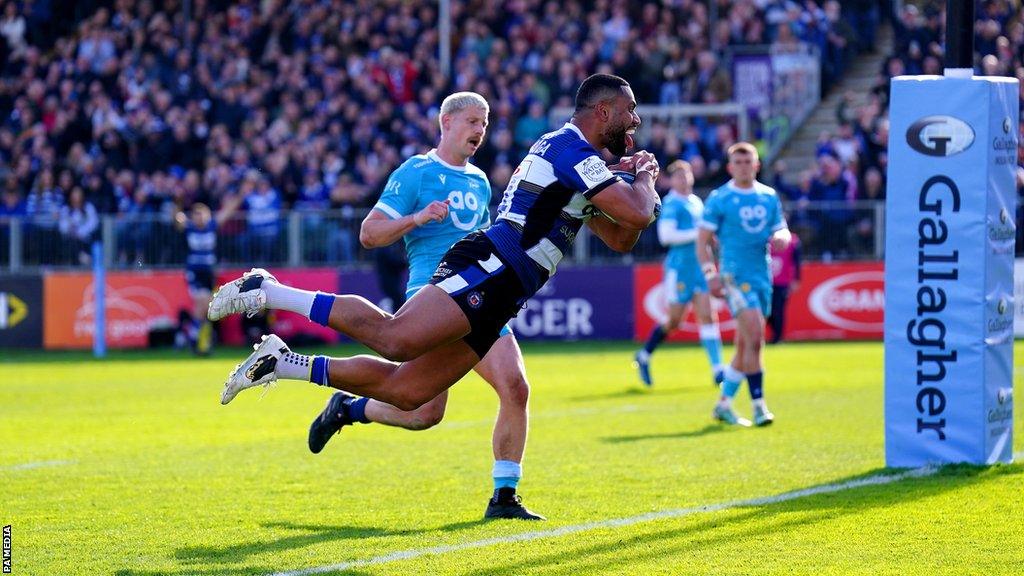 Joe Cokanasiga dives over the line to score Bath's second try against Sale Sharks