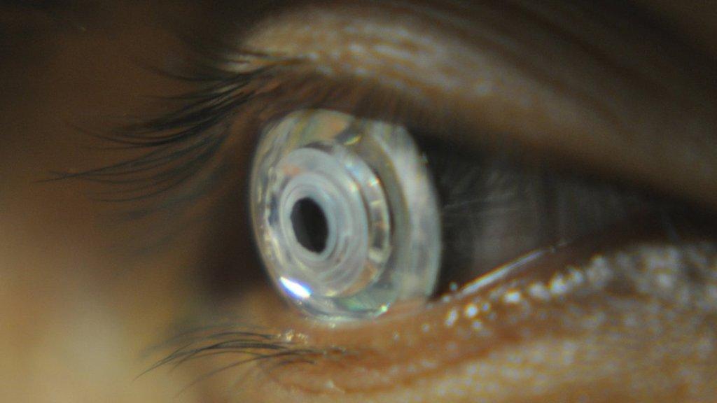 Man's eye wearing the telescopic lens.