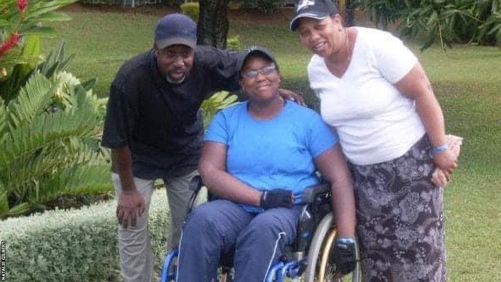 Natalie Gilbert (centre), with dad Lincoln and mum Marie