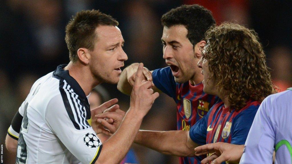 Chelsea defender John Terry argues with Barcelona midfielder Sergio Busquets and Barcelona captain Carles Puyol after receiving a red card from Turkish referee Cuneyt Cakir during the Champions League semi-final second leg in April 2012