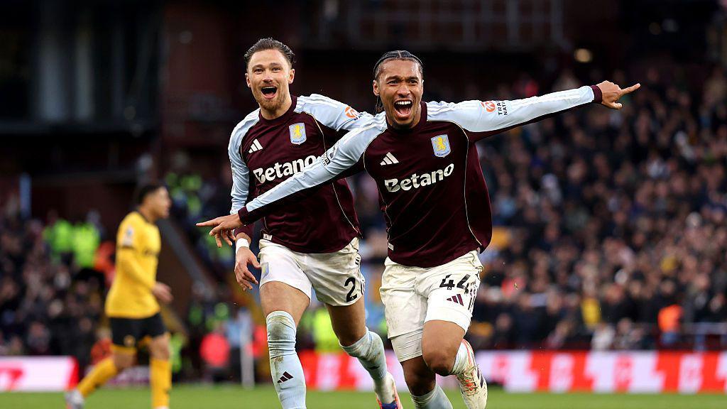 Aston Villa players celebrate a goal