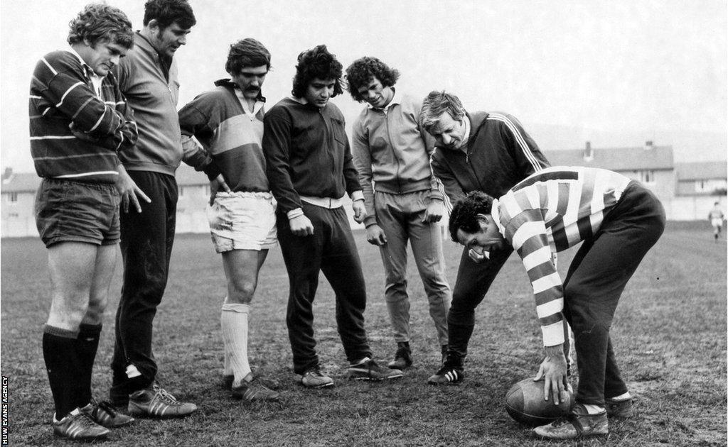 rugby players being coached