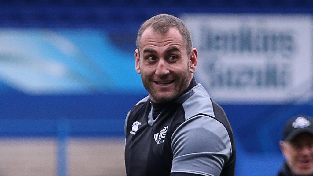 Giorgi Nemsadze smiles during Georgia training