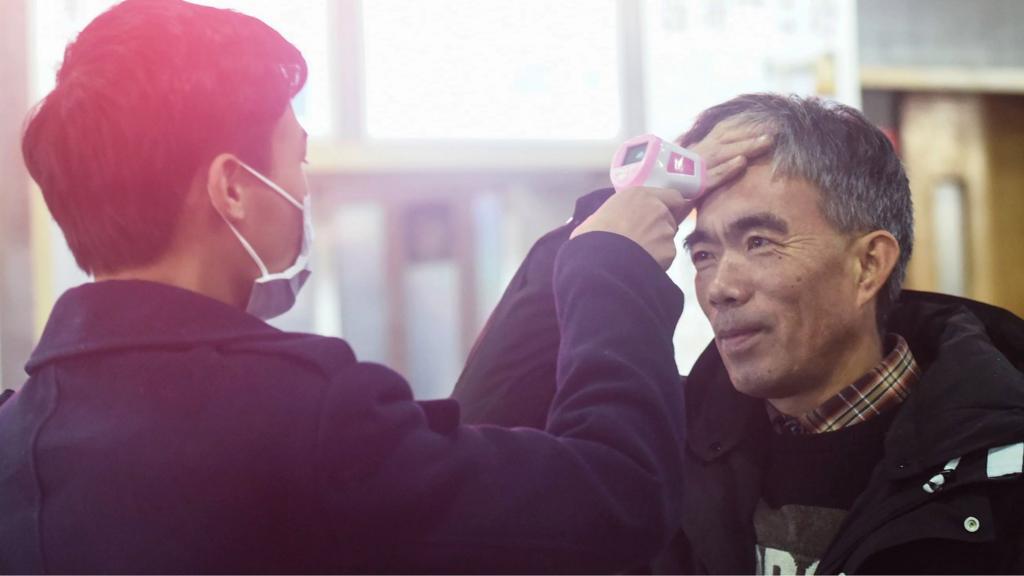 passenger from wuhan is checked at hangzhou railway station