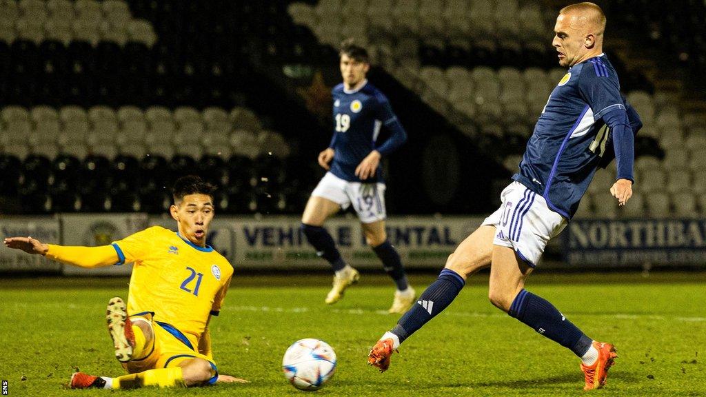 Scotland U21's Lewis Fiorini (right) scores