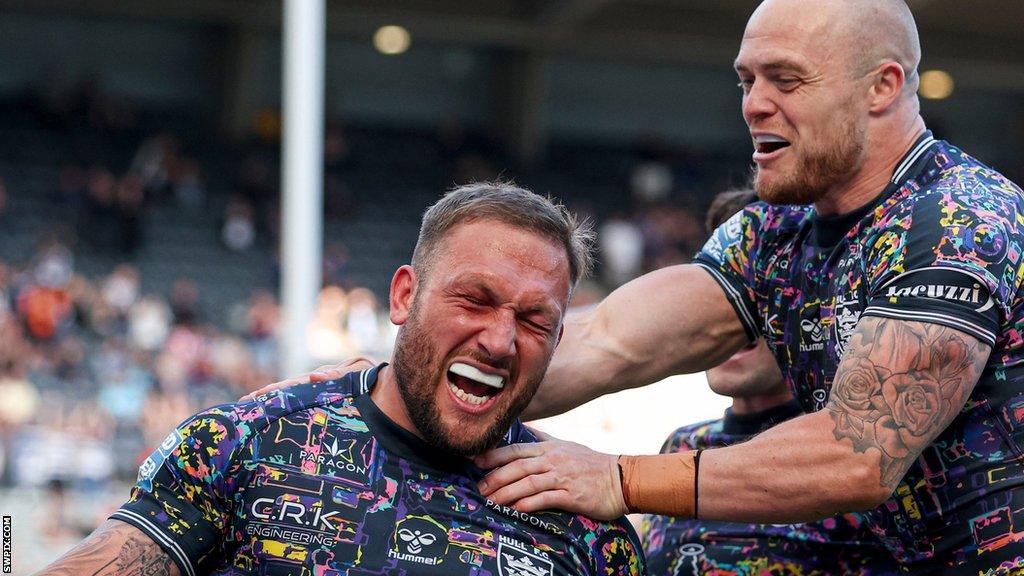 Hull FC's Josh Griffin and Adam Swift celebrate a try against Warrington